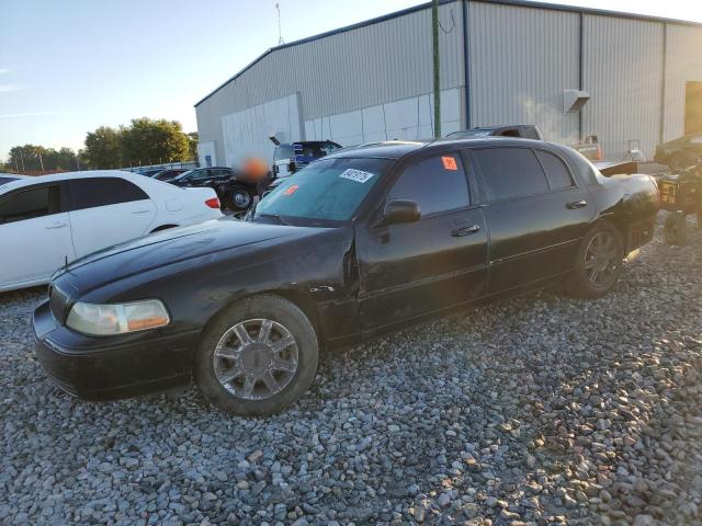 LINCOLN TOWN CAR E 2010 with VIN 2LNBL8EV3AX628099 - Photo from auction