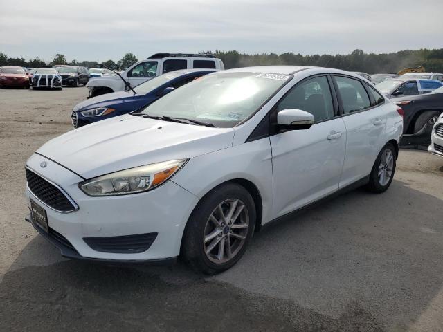 FORD FOCUS SE 2015 with VIN 1FADP3F24FL281692 - Photo from auction