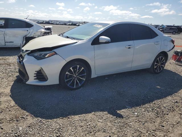 TOYOTA COROLLA L 2019 with VIN 5YFBURHE8KP892783 - Photo from auction