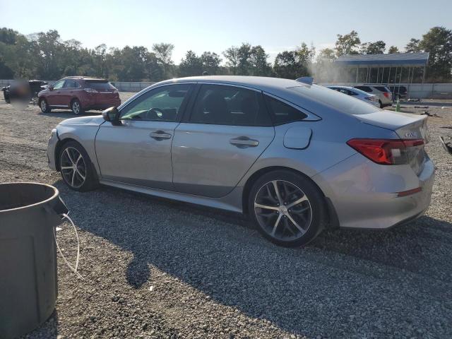 Photo 2 from auction – 2023 HONDA CIVIC TOURING with VIN 2HGFE1F91PH307966