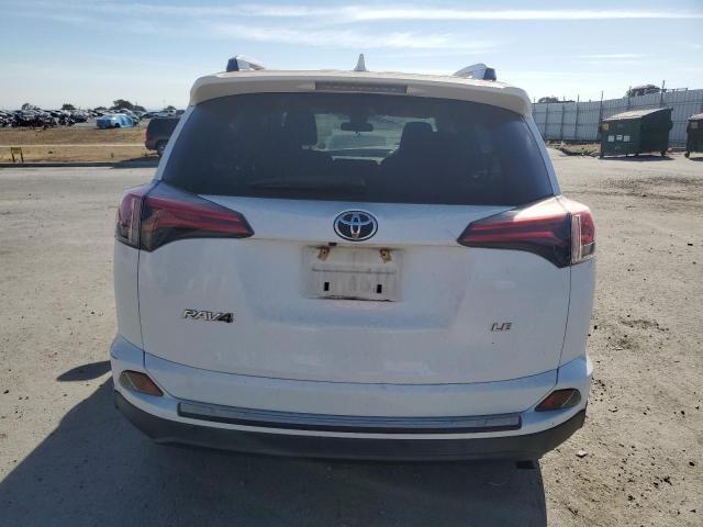 Photo 6 from auction – 2018 TOYOTA RAV4 LE with VIN JTMZFREV2JJ155854