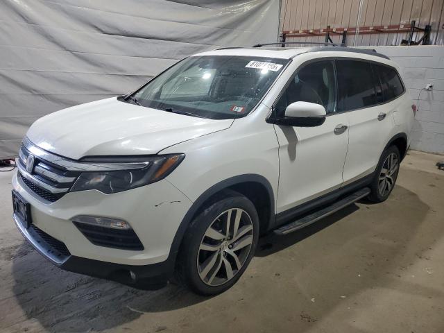 HONDA PILOT TOURING 2017 with VIN 5FNYF6H98HB000509 - Photo from auction