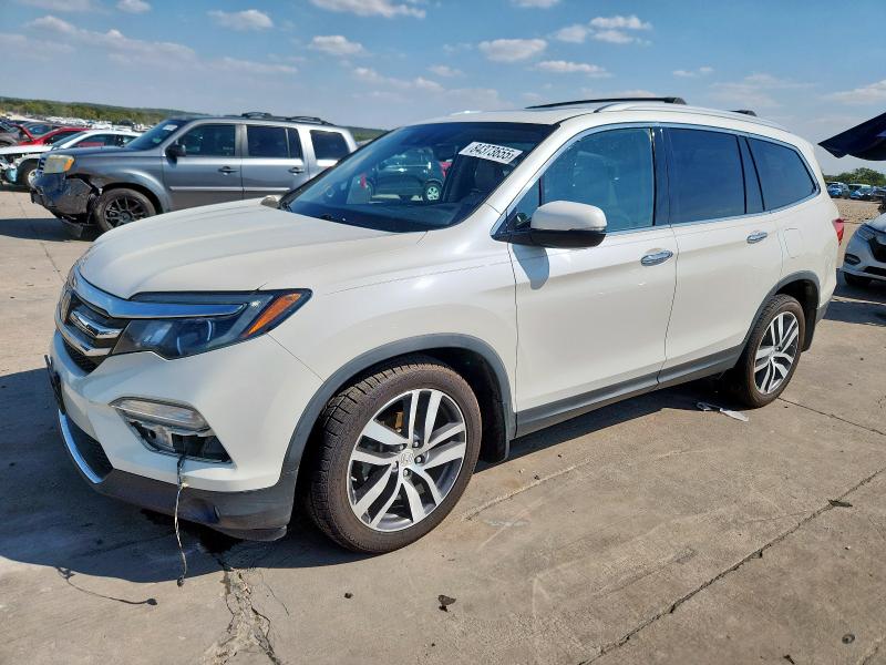 HONDA PILOT TOUR 2017 with VIN 5FNYF5H93HB014523 - Photo from auction