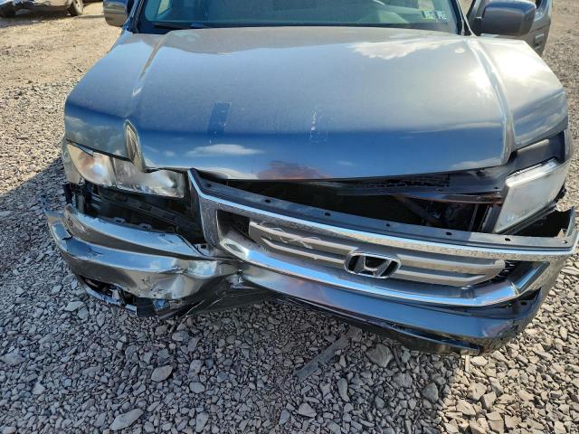 Photo 11 from auction – 2010 HONDA RIDGELINE with VIN 5FPYK1F50AB011015