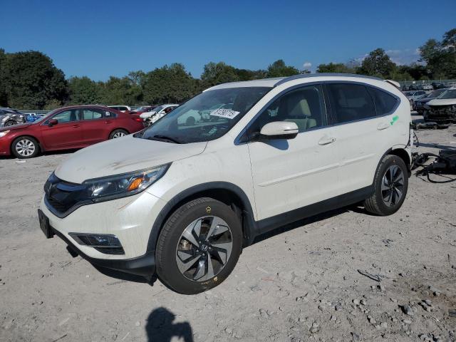 HONDA CR-V TOURING 2016 with VIN 5J6RM4H90GL007023 - Photo from auction