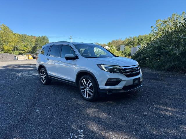 HONDA PILOT TOUR 2017 with VIN 5FNYF6H92HB005673 - Photo from auction