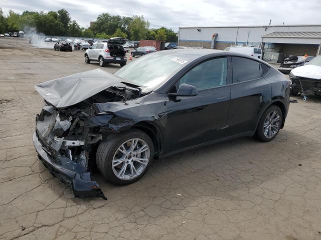 TESLA MODEL Y 2023 con VIN 7SAYGAEE6PF860007 - Foto de la subasta