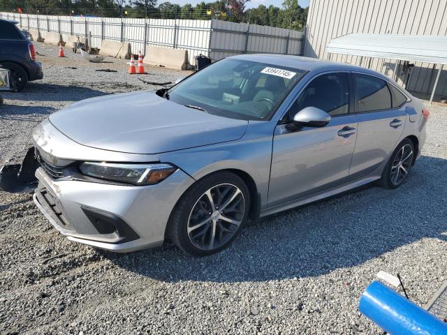 HONDA CIVIC TOURING 2023 with VIN 2HGFE1F91PH307966 - Photo from auction