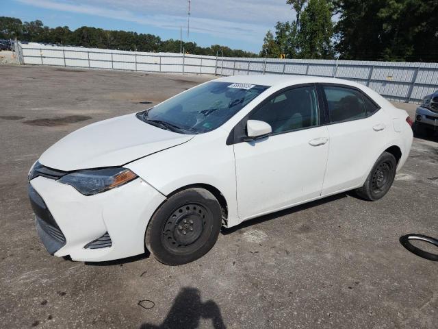 TOYOTA COROLLA L 2019 with VIN 5YFBURHE9KP895756 - Photo from auction