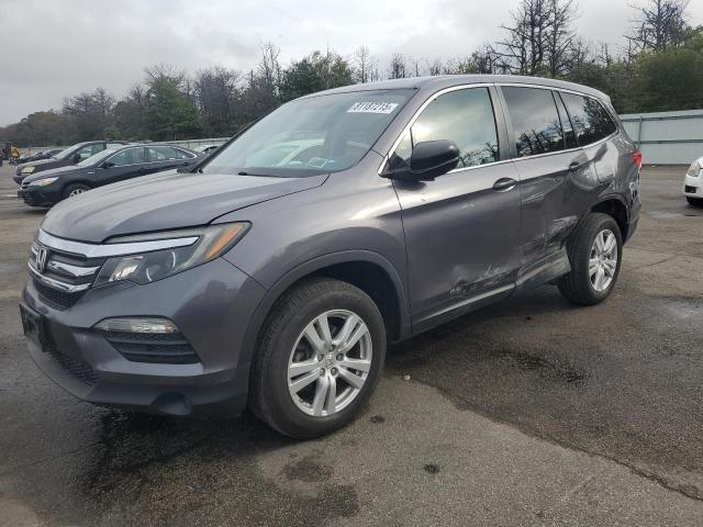 HONDA PILOT LX 2018 with VIN 5FNYF6H17JB054304 - Photo from auction