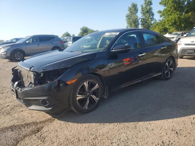 HONDA CIVIC TOUR 2016 with VIN 2HGFC1F97GH111438 - Photo from auction