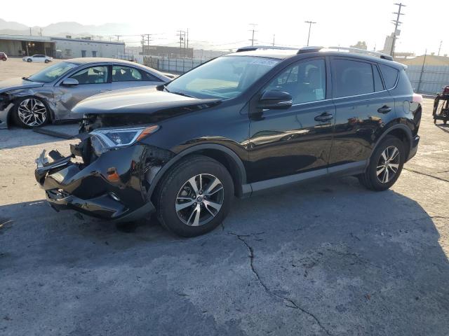 TOYOTA RAV4 XLE 2016 with VIN 2T3WFREV3GW309128 - Photo from auction