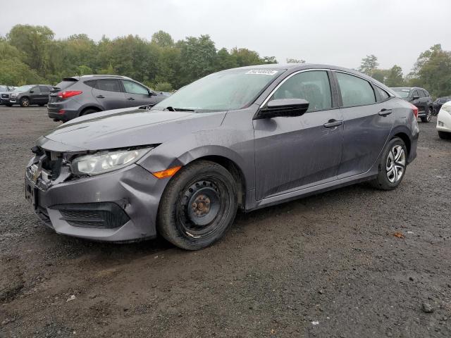 HOND CIVIC LX 2018 with VIN 19XFC2F59JE202053 - Photo from auction