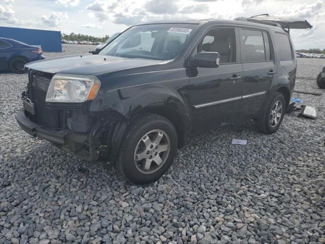 HONDA PILOT TOUR 2011 with VIN 5FNYF3H9XBB029662 - Photo from auction