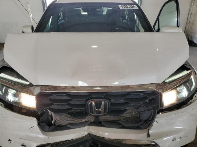 Photo 12 from auction – 2024 HONDA PASSPORT E with VIN 5FNYF8H57RB007851