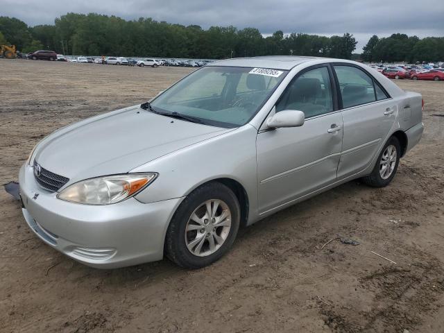 TOYOTA CAMRY LE 2004 with VIN 4T1BF30K54U571522 - Photo from auction