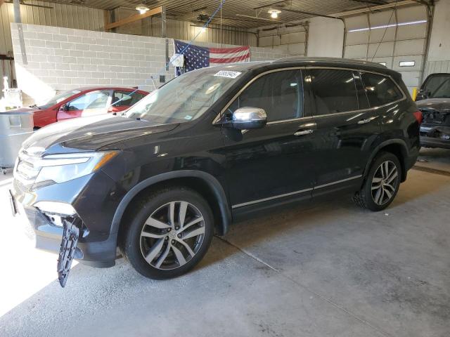 HONDA PILOT TOUR 2016 with VIN 5FNYF5H93GB033457 - Photo from auction