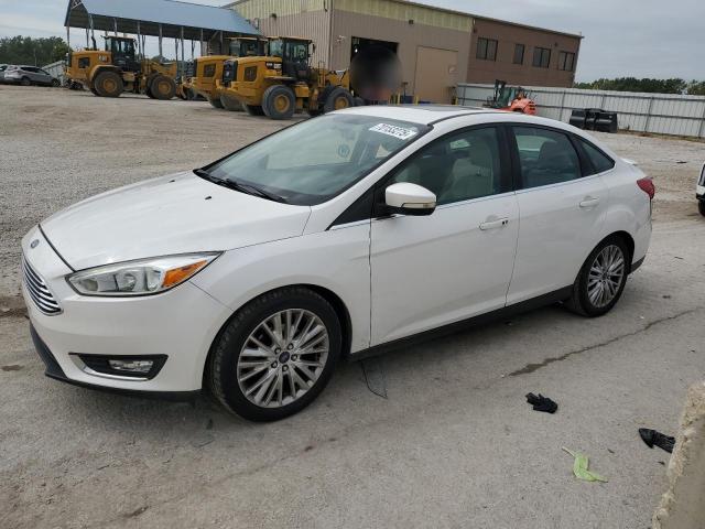 FORD FOCUS TITANIUM 2017 with VIN 1FADP3J23HL264716 - Photo from auction