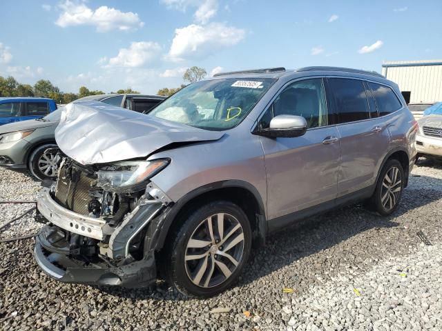 HONDA PILOT TOUR 2017 with VIN 5FNYF6H94HB068161 - Photo from auction