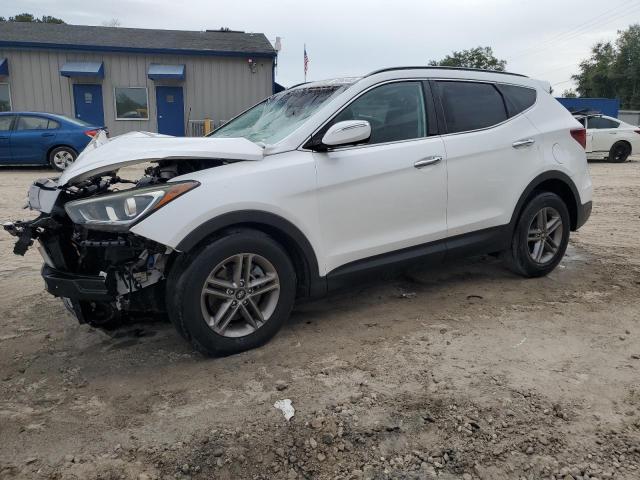 HYUNDAI SANTA FE S 2018 with VIN 5NMZU3LB0JH101597 - Photo from auction