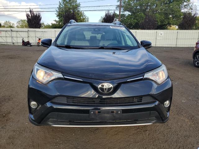 Photo 5 from auction – 2017 TOYOTA RAV4 XLE with VIN 2T3RFREV7HW682235