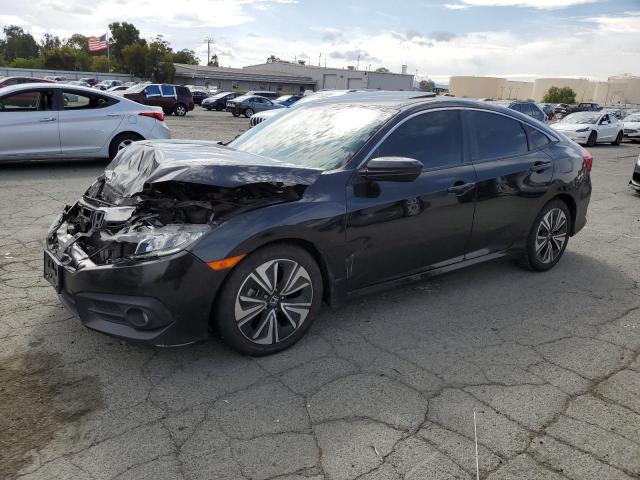 HONDA CIVIC EX 2018 with VIN JHMFC1F33JX037687 - Photo from auction