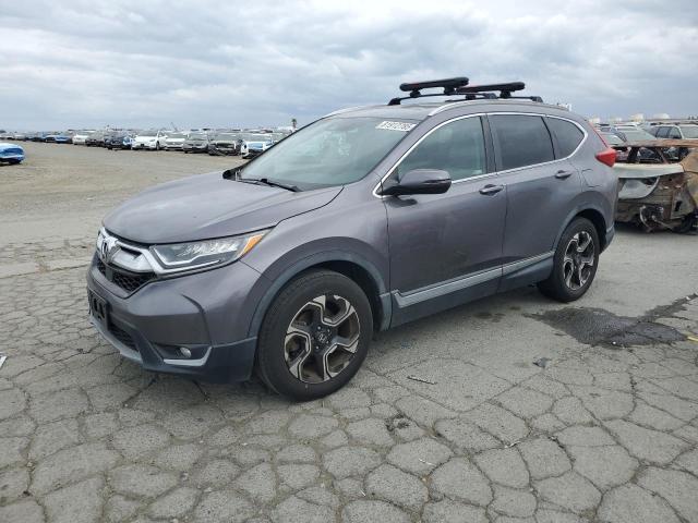 HONDA CR-V TOURING 2018 with VIN 7FARW2H97JE050308 - Photo from auction