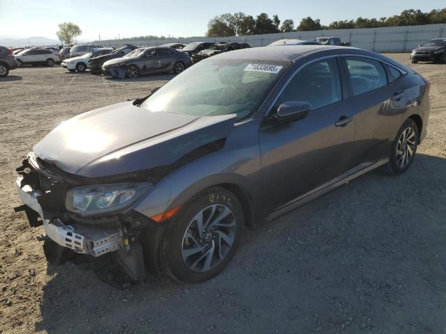 Photo 1 from auction – 2018 HONDA CIVIC EX with VIN 19XFC2F74JE209171