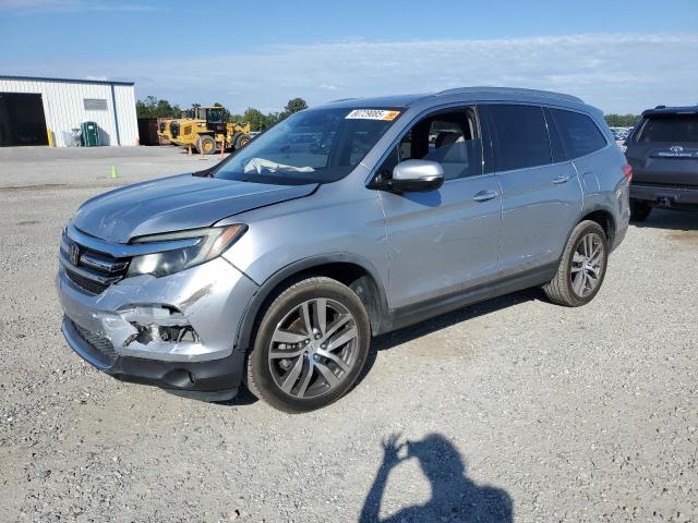 HONDA PILOT TOUR 2017 with VIN 5FNYF5H98HB027672 - Photo from auction
