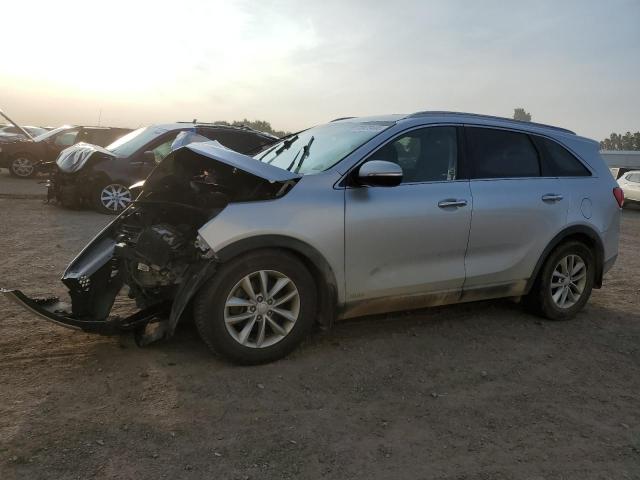 KIA SORENTO LX 2016 with VIN 5XYPGDA32GG037999 - Photo from auction