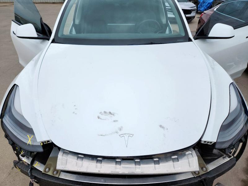 Photo 11 from auction – 2023 TESLA MODEL Y with VIN 7SAYGAEE9PF625147