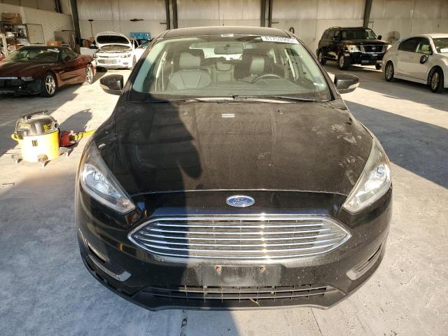 Photo 5 from auction – 2015 FORD FOCUS TITA with VIN 1FADP3N24FL305958