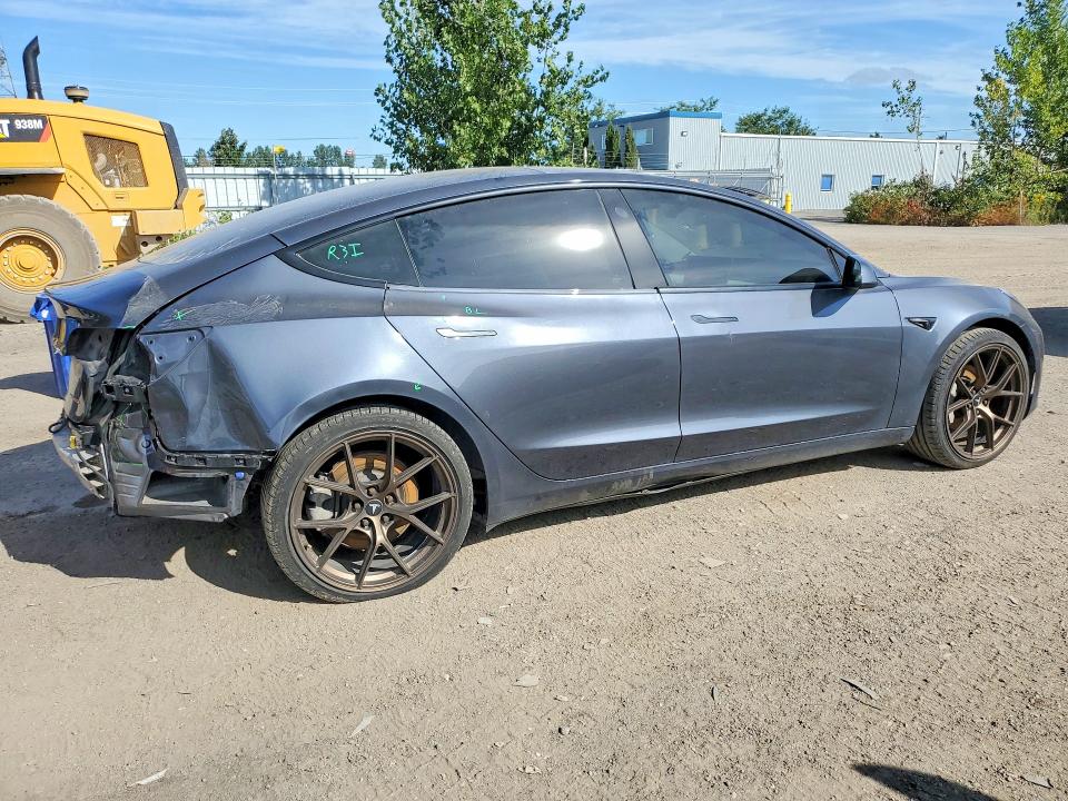 Снимка 3 от търг – 2022 TESLA MODEL 3 с VIN 5YJ3E1EB0NF241306