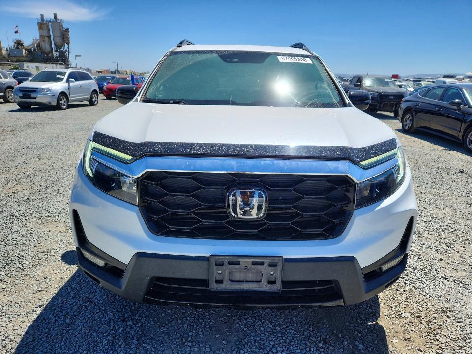 Photo 5 from auction – 2023 HONDA PASSPORT with VIN 5FNYF8H03PB005936