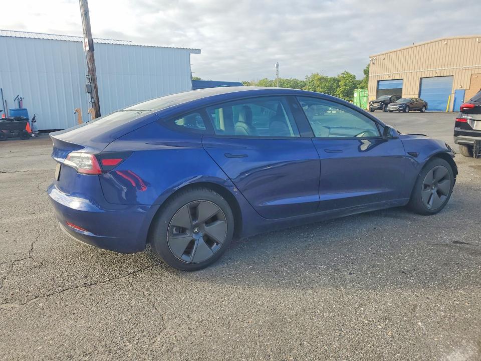 Снимка 3 от търг – 2022 TESLA MODEL 3 с VIN 5YJ3E1EAXNF370385