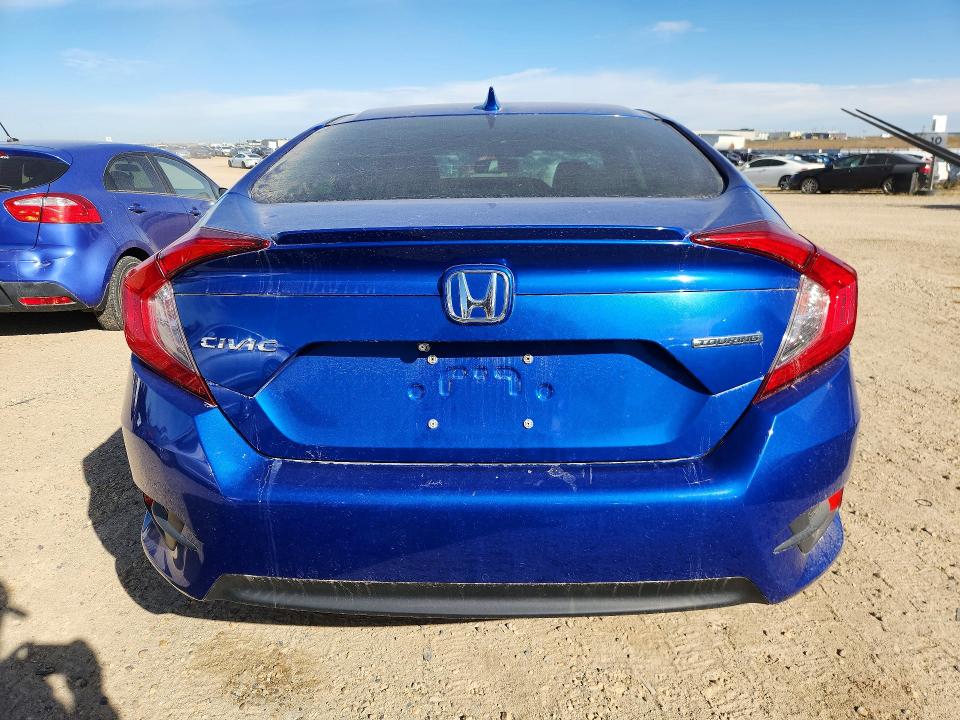 Photo 6 from auction – 2018 HONDA CIVIC with VIN 2HGFC1F91JH104640