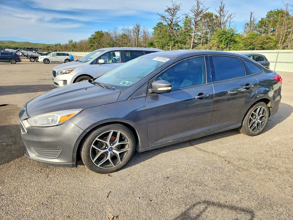 FORD FOCUS 2017 with VIN 1FADP3E21HL261940 - Photo from auction
