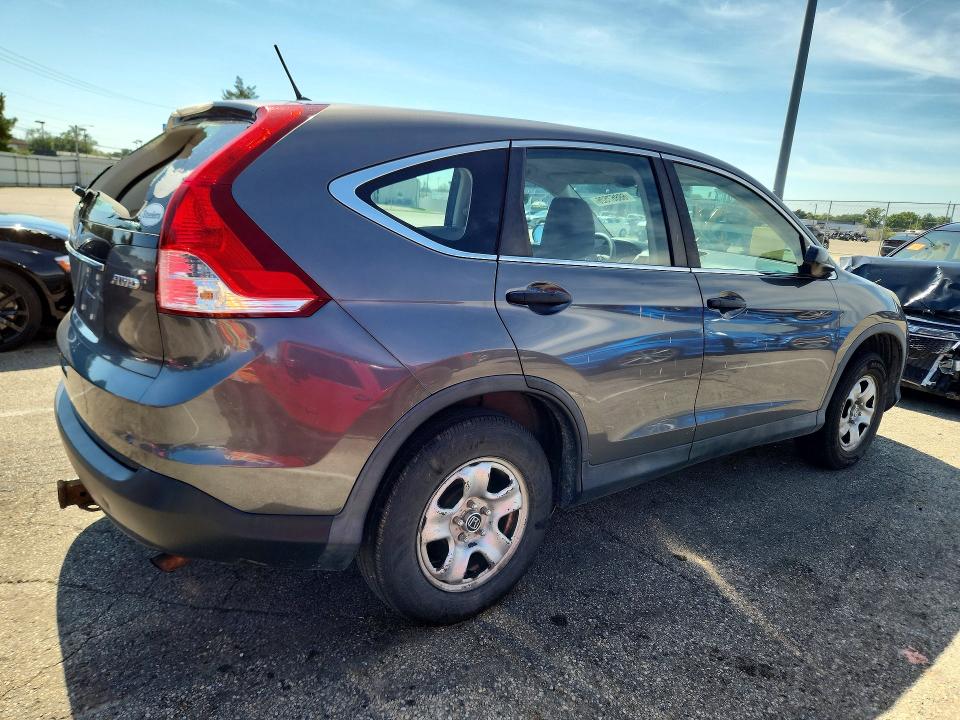 Photo 3 from auction – 2014 HONDA CR-V with VIN 2HKRM4H31EH670815