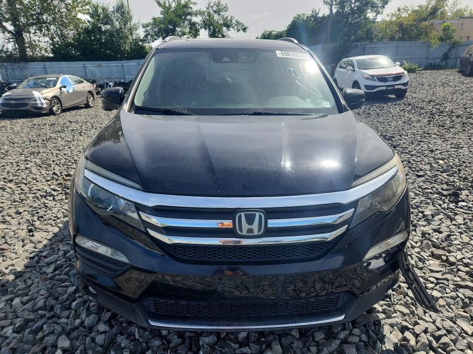 Photo 5 from auction – 2016 HONDA PILOT with VIN 5FNYF6H9XGB001093