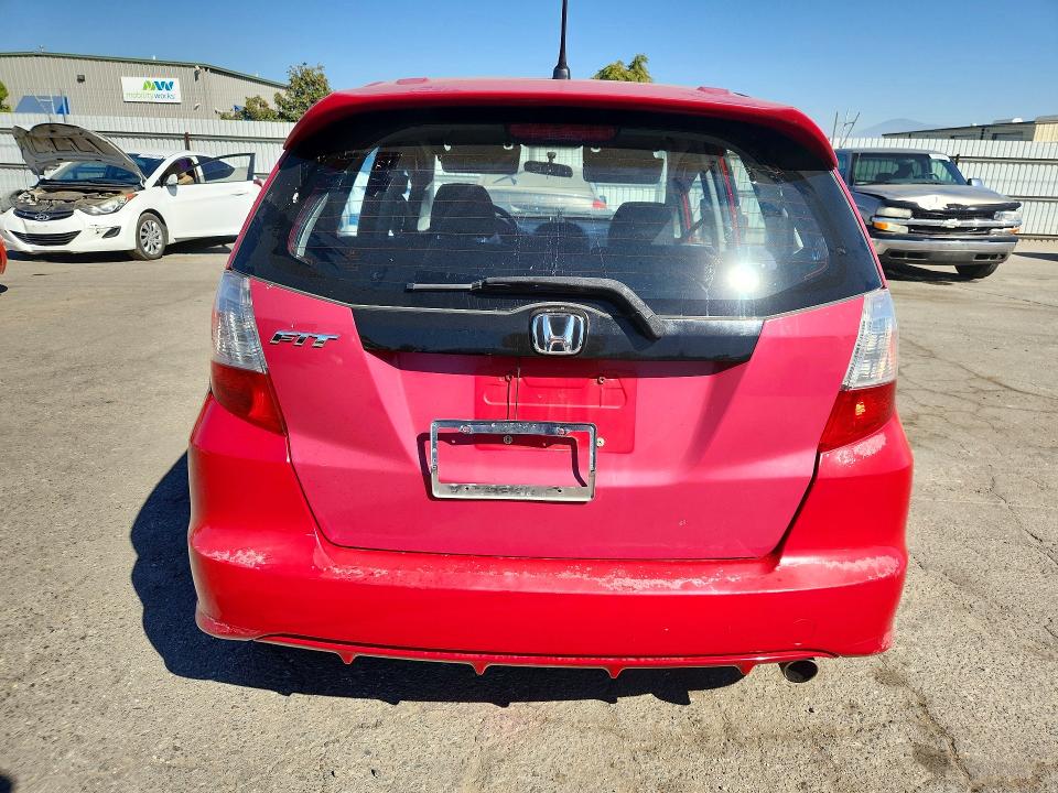 Снимка 6 от търг – 2009 HONDA FIT с VIN JHMGE88429S028629