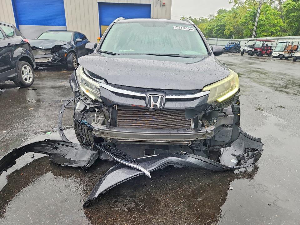 Photo 5 from auction – 2016 HONDA CR-V with VIN 2HKRM4H76GH623723