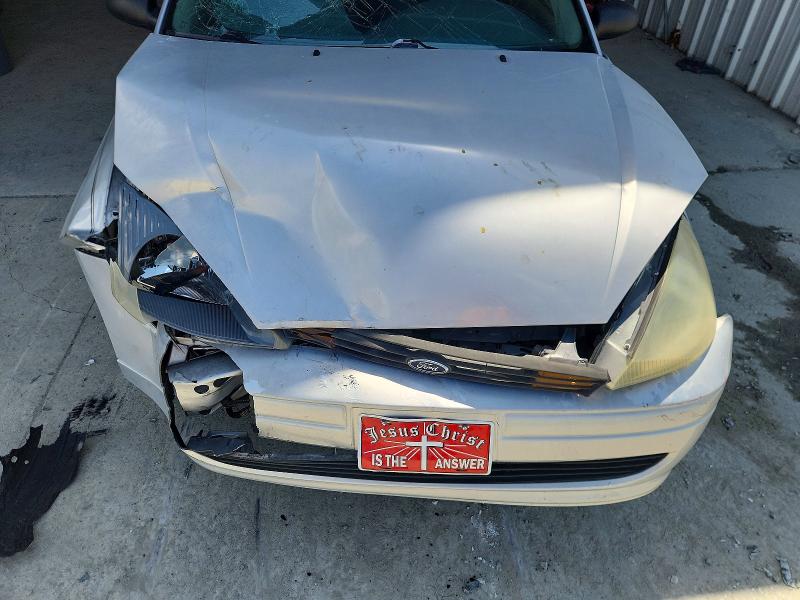 Снимка 12 от търг – 2004 FORD FOCUS с VIN 1FAFP36304W120494
