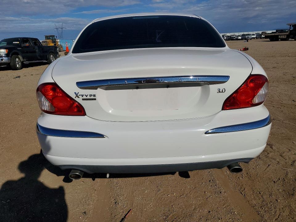 Фото 6 с аукциона – 2004 JAGUAR X-TYPE с VIN SAJEA51C14WE00049