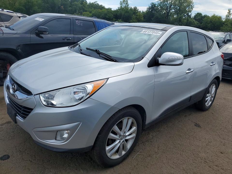 HYUNDAI TUCSON 2010 with VIN KM8JUCAC3AU024883 - Photo from auction