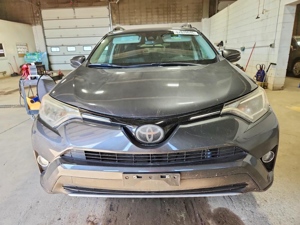 Photo 5 from auction – 2018 TOYOTA RAV4 with VIN 2T3RFREV7JW781918
