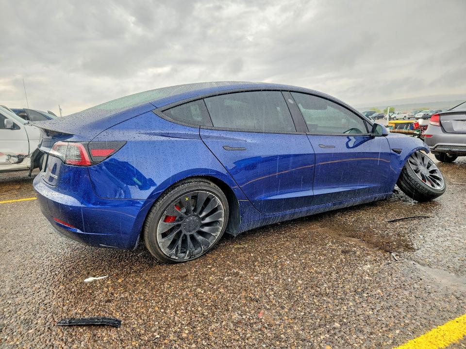 Снимка 3 от търг – 2023 TESLA MODEL 3 с VIN 5YJ3E1EC3PF552143
