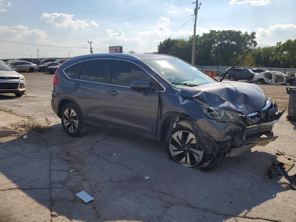 Photo 4 from auction – 2015 HONDA CR-V with VIN 5J6RM4H92FL105324
