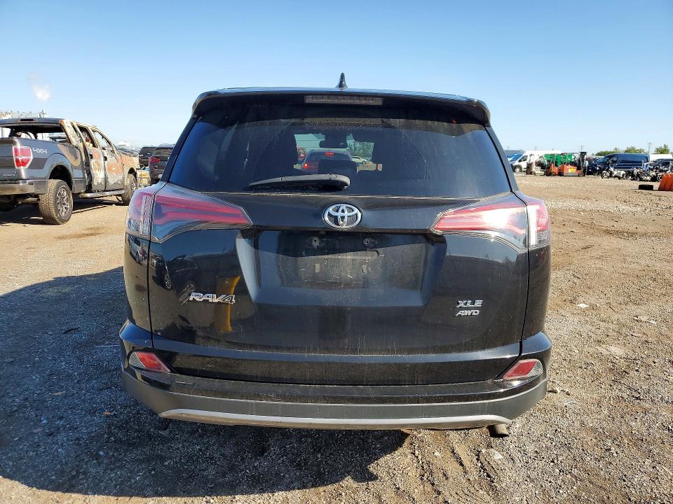 Photo 6 from auction – 2018 TOYOTA RAV4 with VIN 2T3RFREV7JW704997