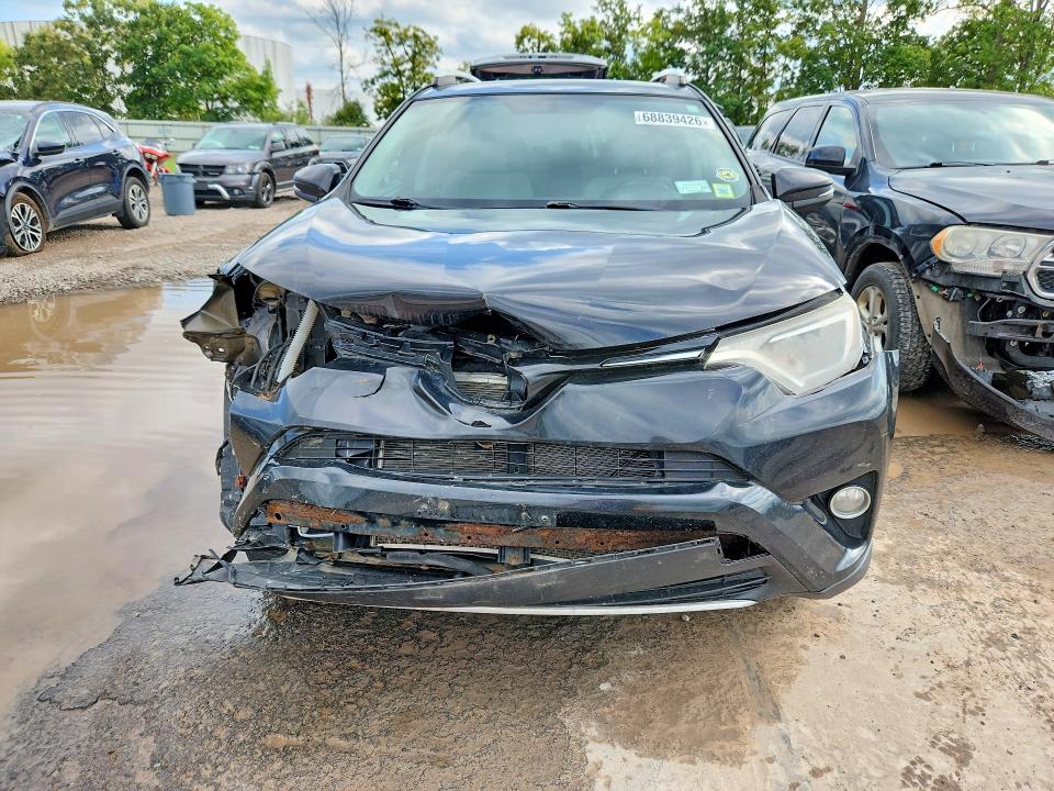 Photo 5 from auction – 2016 TOYOTA RAV4 with VIN 2T3RFREVXGW508853