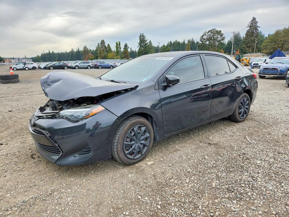 TOYOTA COROLLA 2018 with VIN 5YFBURHE0JP815212 - Photo from auction